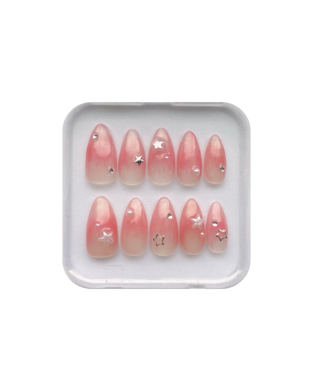Set of jelly pink (translucent pink) press ons in a clear plastic case on a white background. Silver stars, silver gems, and pearl star, and pearl detailing. 