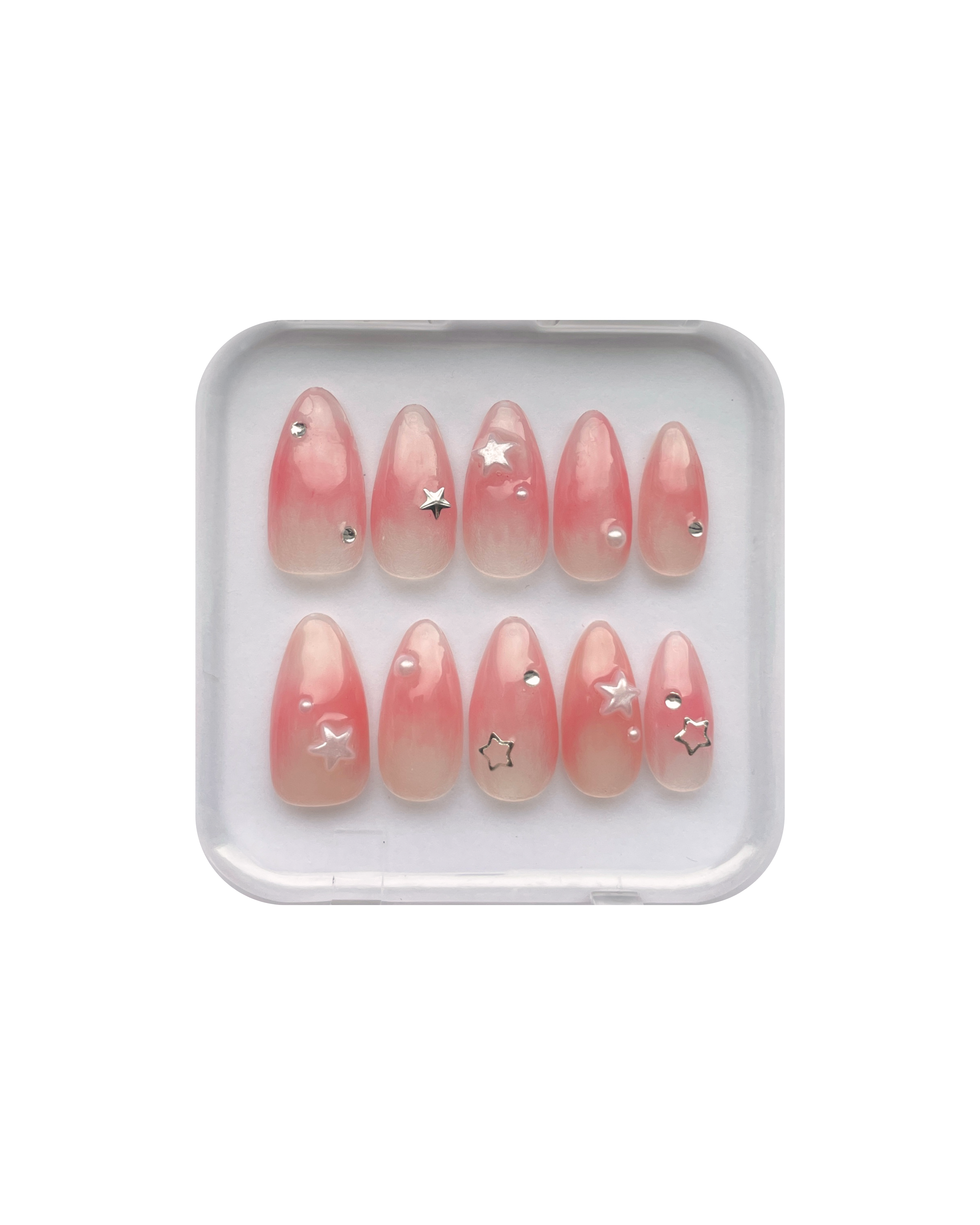Set of jelly pink (translucent pink) press ons in a clear plastic case on a white background. Silver stars, silver gems, and pearl star, and pearl detailing. 