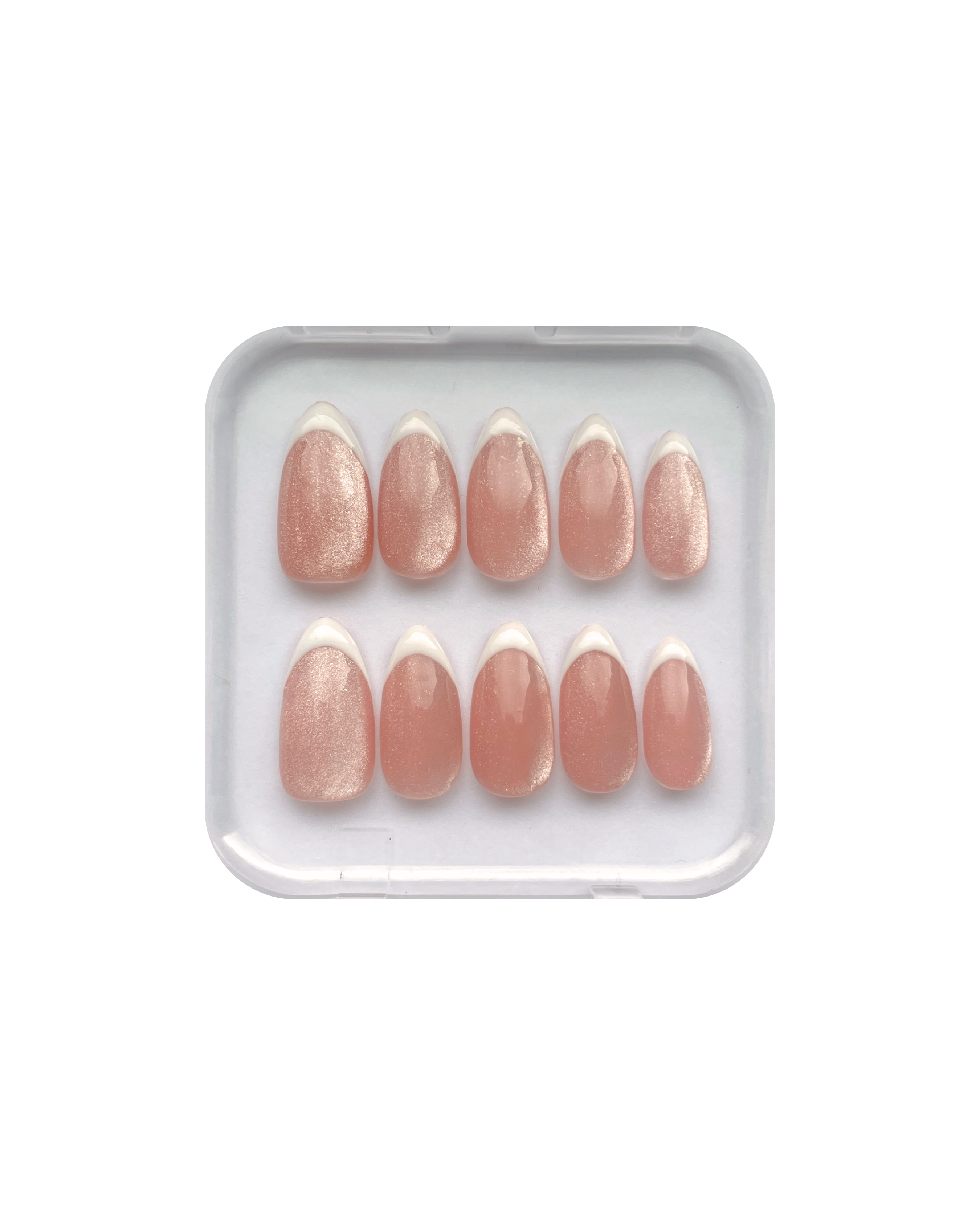 Set of pink press on nails in a clear plastic tray on a white background. Pink cat eye nails with white french tips, all in almond shape. 