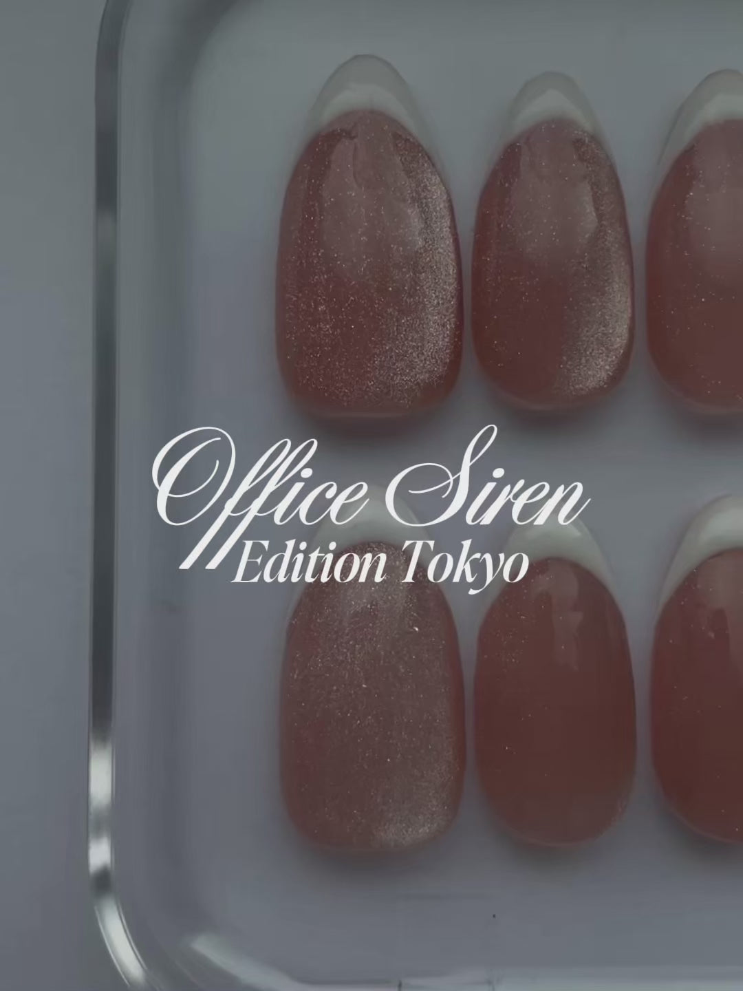 Office Siren: Edition Tokyo Jelly Nails. Pink Cat Eye Almond nails with white french tips. 